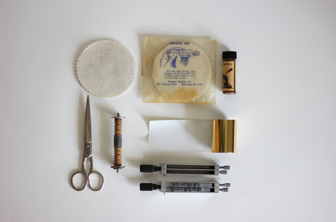 Mascara tube components showing tube body, wiper, wand brush assembly, and cap