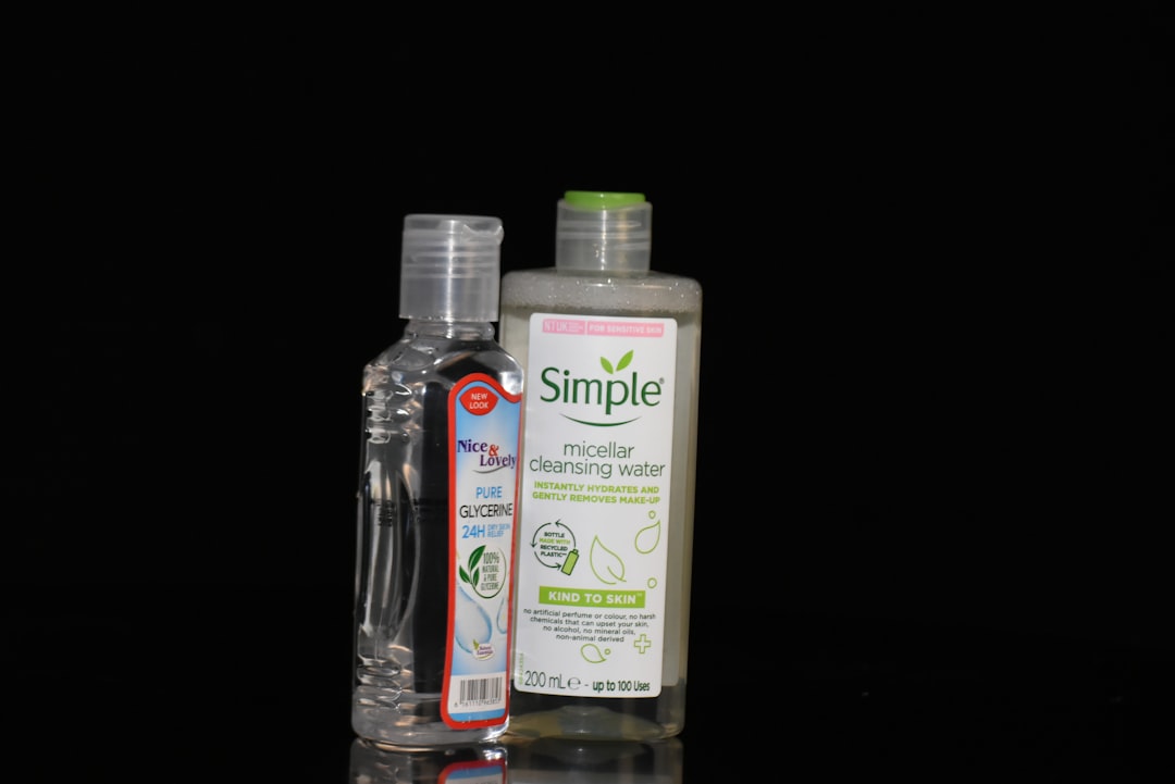 Airless pump bottle dispensing organic skincare serum showing vacuum piston mechanism