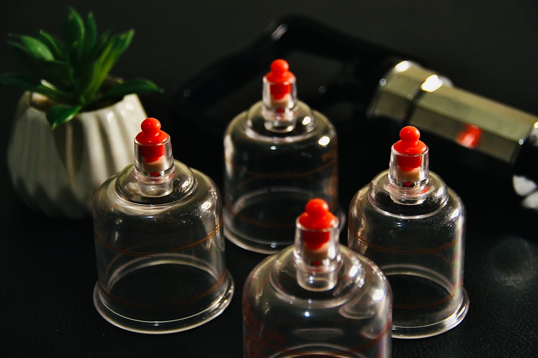 Cosmetic packaging bottles undergoing temperature stress testing in a laboratory setting