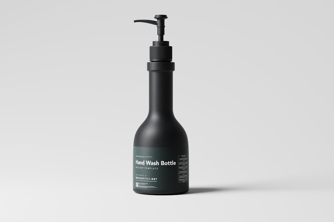 Cosmetic pump dispenser bottles with tamper evident shrink bands on a production line